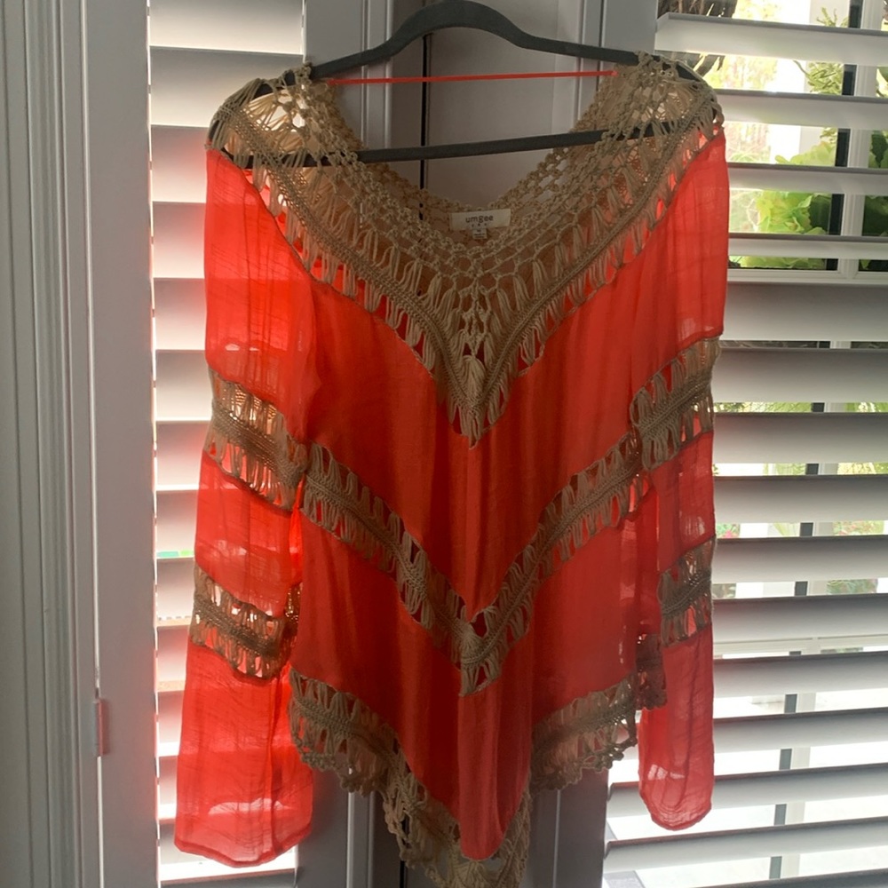 Umgee brand beautiful tunic with crotchet design and flowing sleeves and bottom